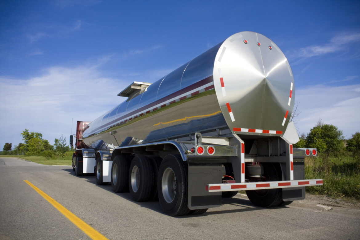 Fuel tanker carries inventory to retail sites as part of supply chain logistics
