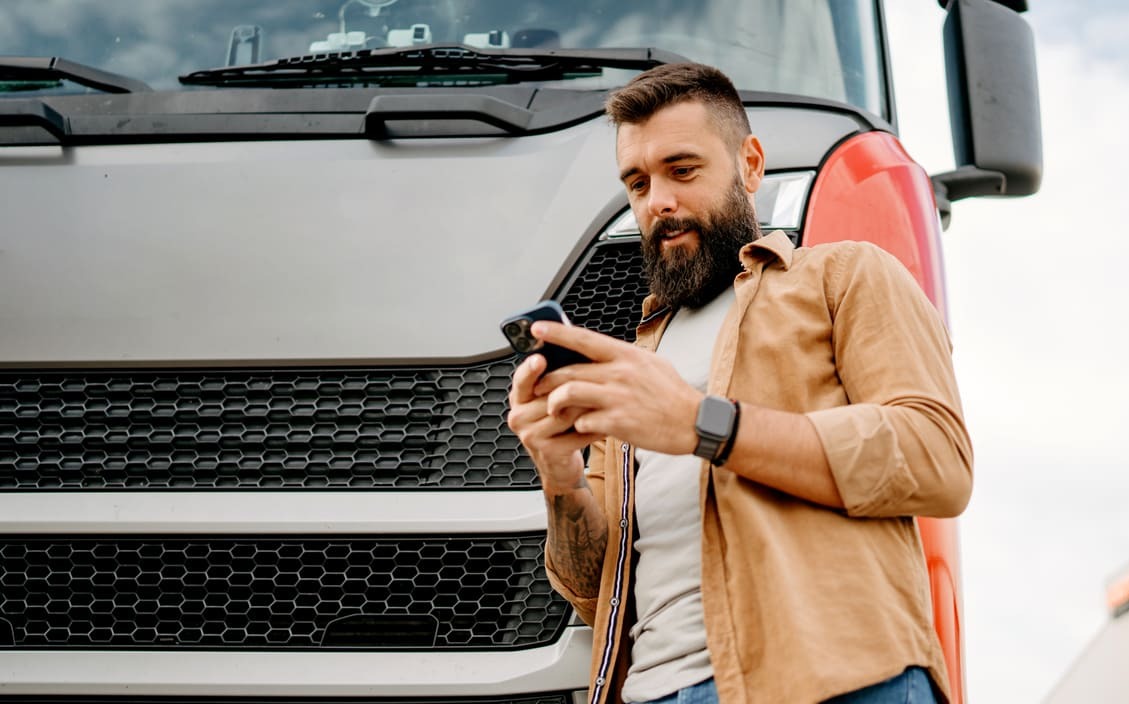 Driver using his mobile app to confirm his schedule and fuel loads