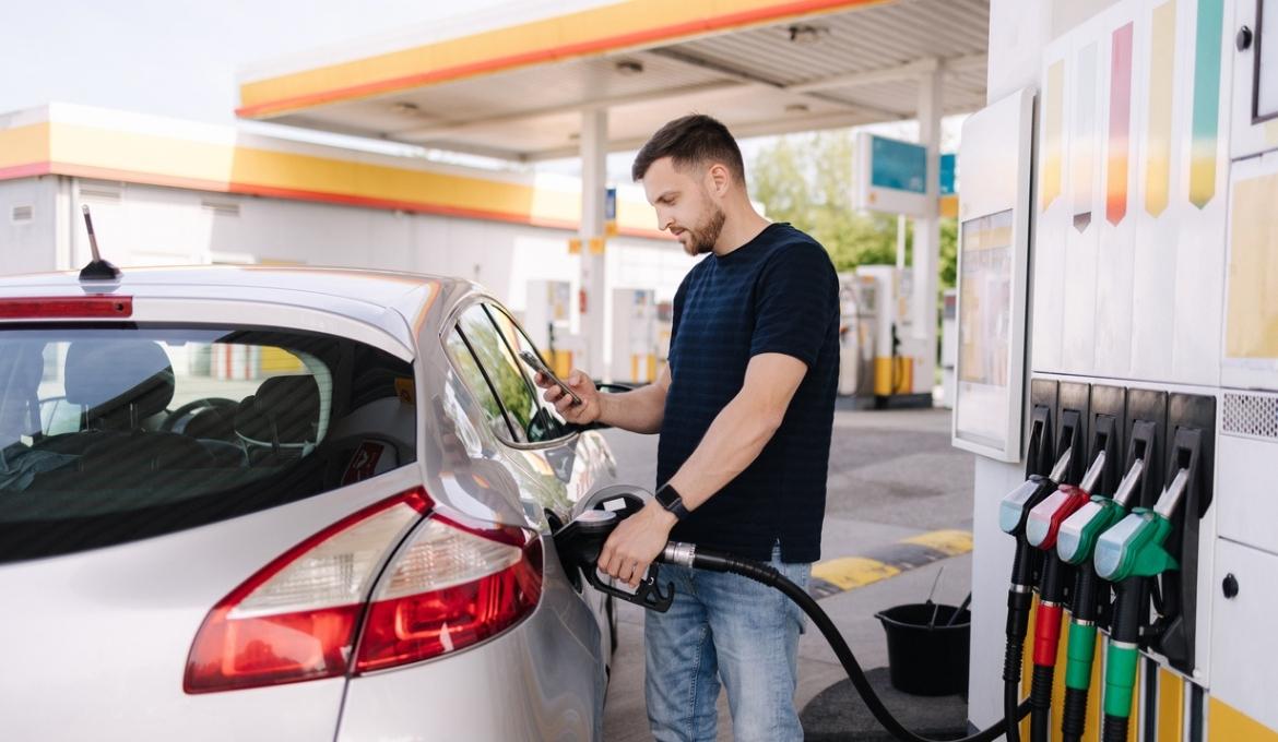 Man filling up his car at a petrol station