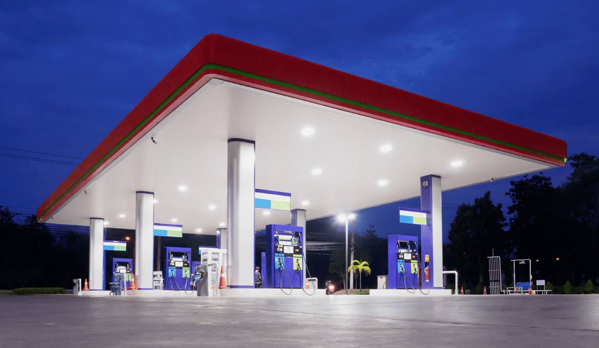 well-lit forecourt station at night